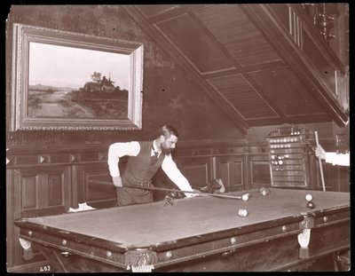 Edwin Gould playing pool at his home in Rhinecliffe, New York, 1893-4 by Byron Company